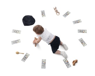 Photo of Little baby, money and toys on white background, above view