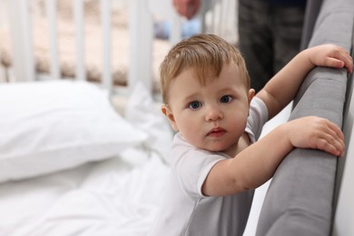 Photo of Cute little baby on bed at home