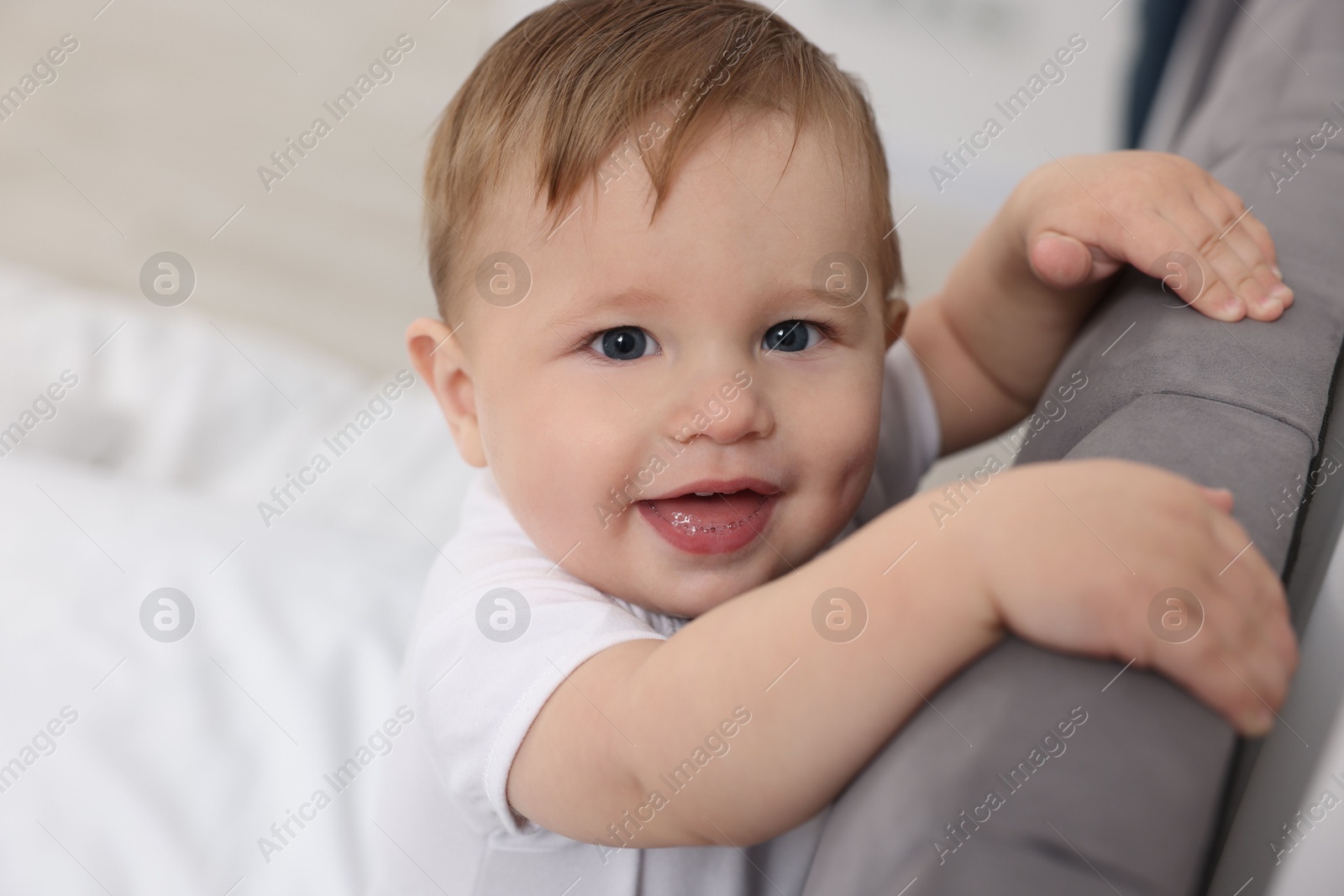 Photo of Cute little baby on bed at home