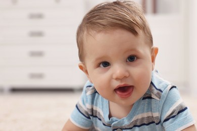 Photo of Portrait of adorable baby boy at home