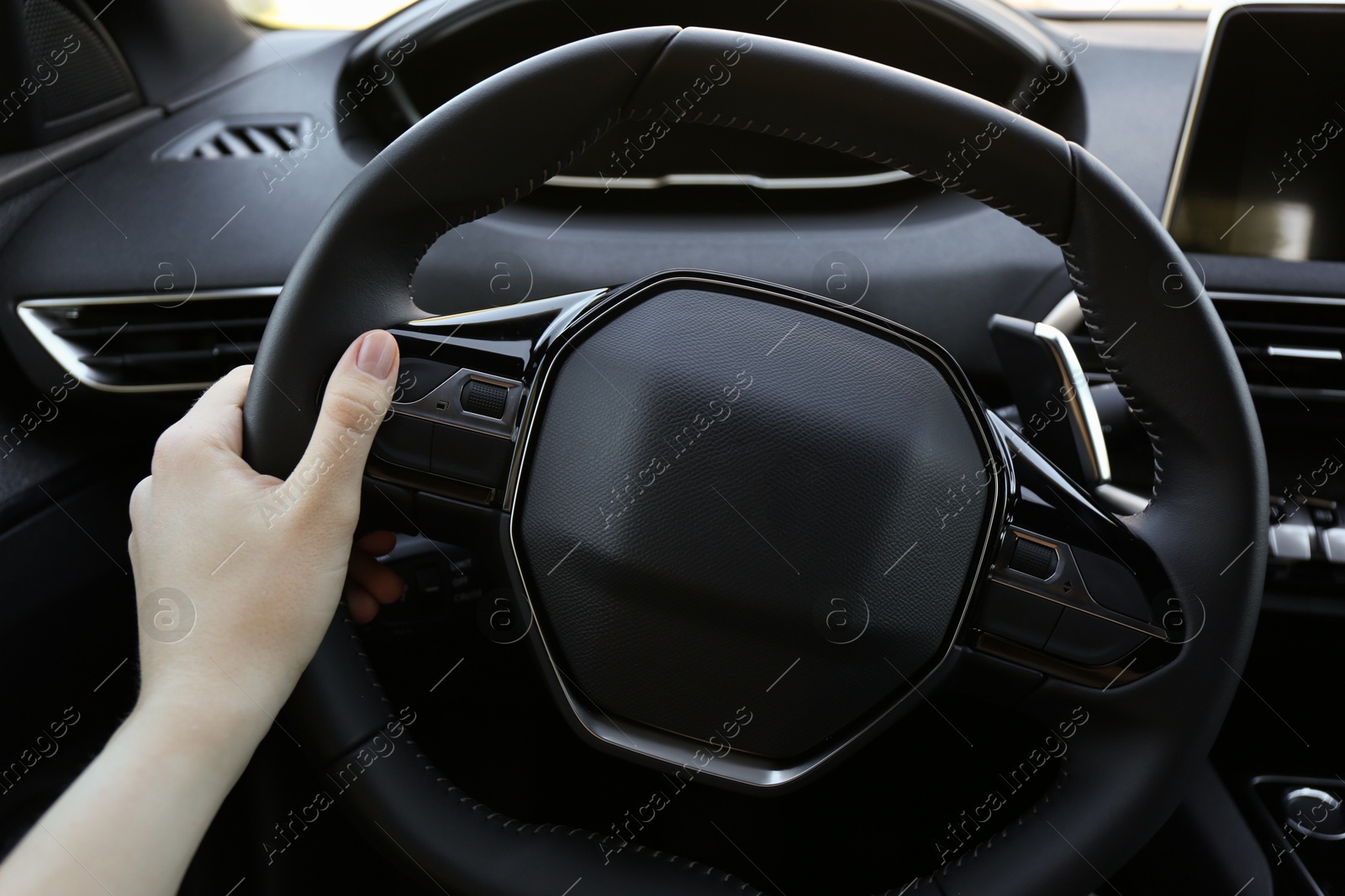 Photo of Woman inside of modern luxury car, closeup view