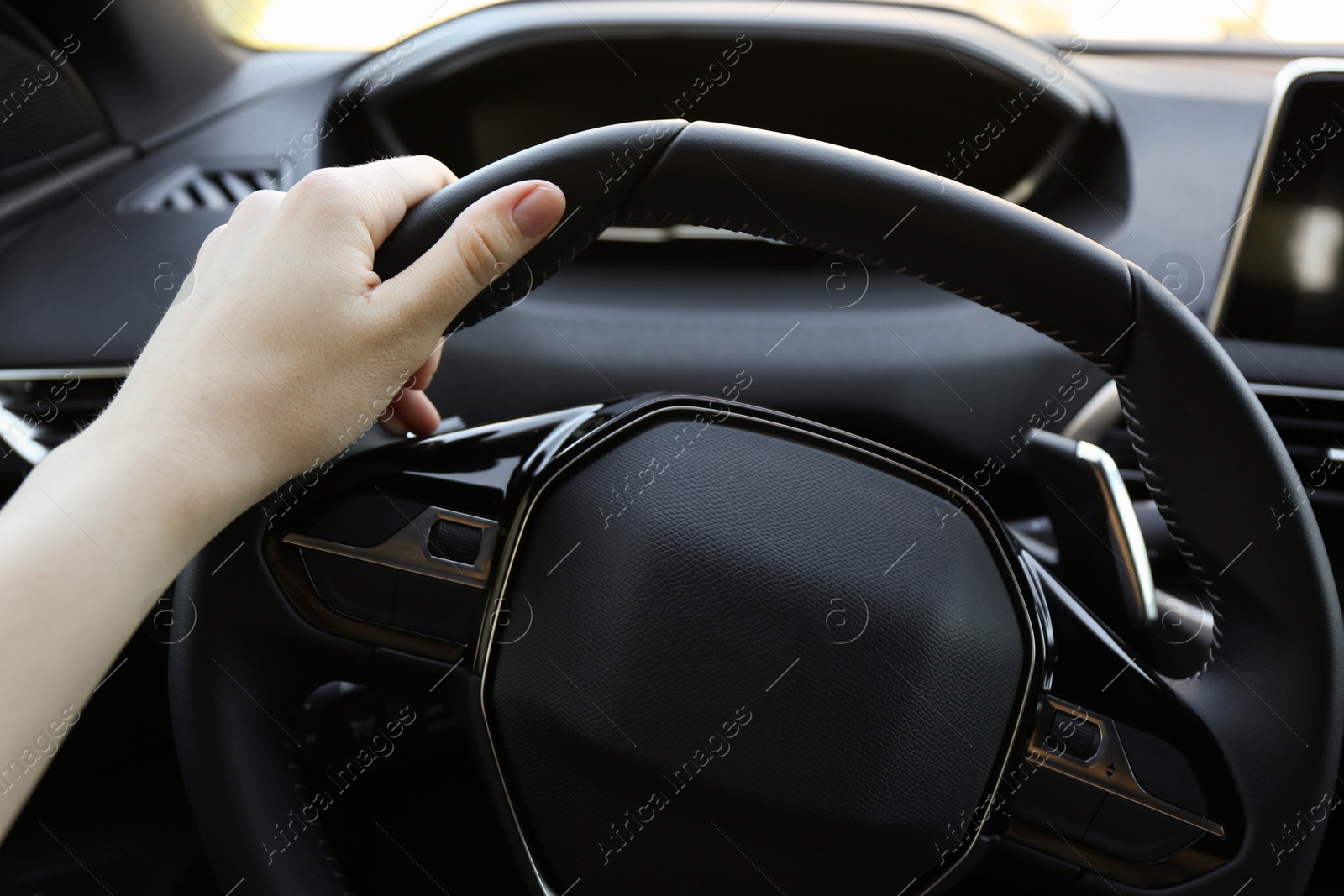 Photo of Woman inside of modern luxury car, closeup view