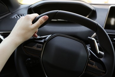 Woman inside of modern luxury car, closeup view