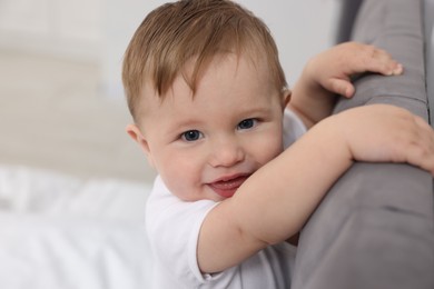 Photo of Cute little baby on bed at home