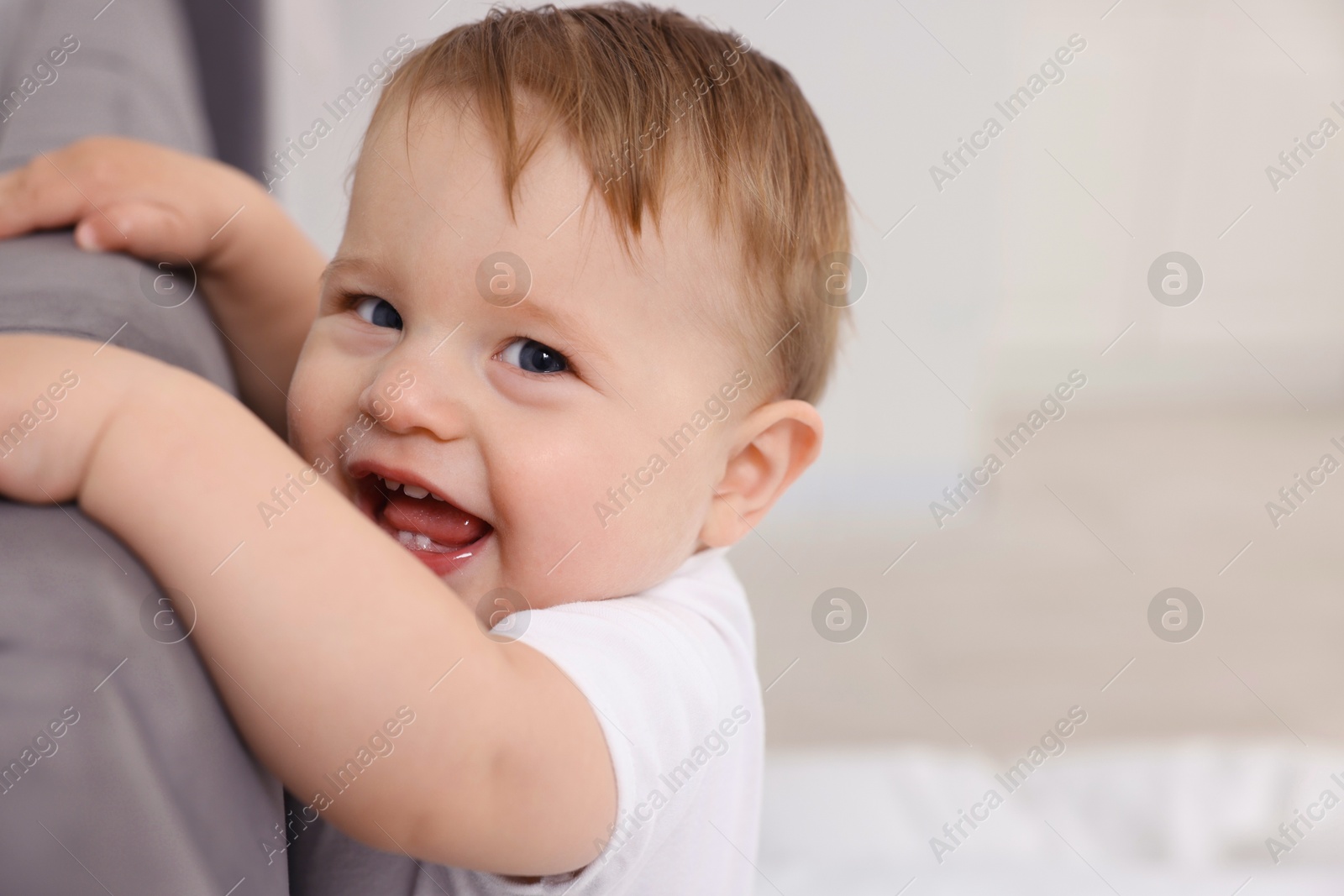 Photo of Cute little baby on bed at home