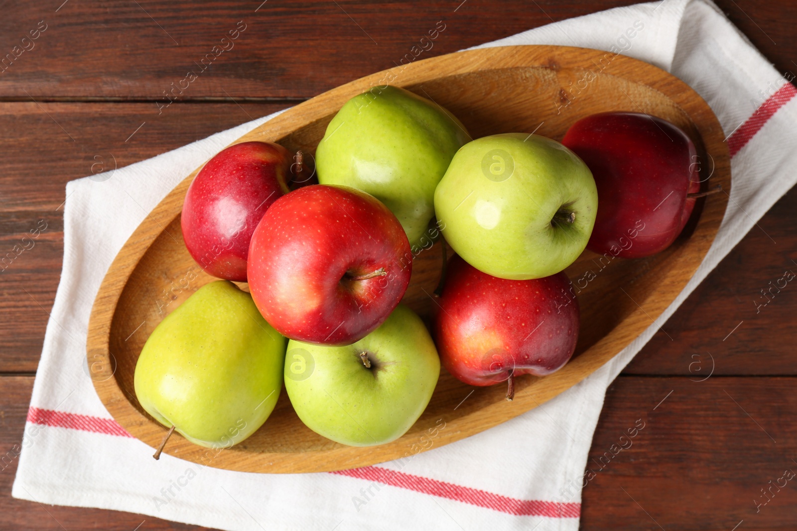 Photo of Fresh red and green apples on wooden table, top view