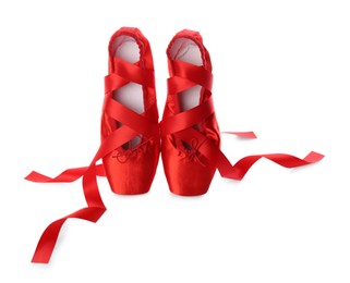 Photo of Pair of beautiful red pointe shoes isolated on white