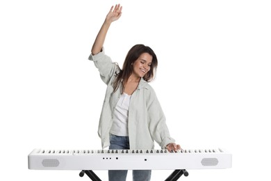 Photo of Smiling woman playing synthesizer on white background