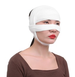 Photo of Woman with nose wrapped in medical bandage after plastic surgery operation on white background