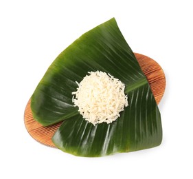 Cut banana leaf with pile of rice isolated on white, top view. Healthy eco serving