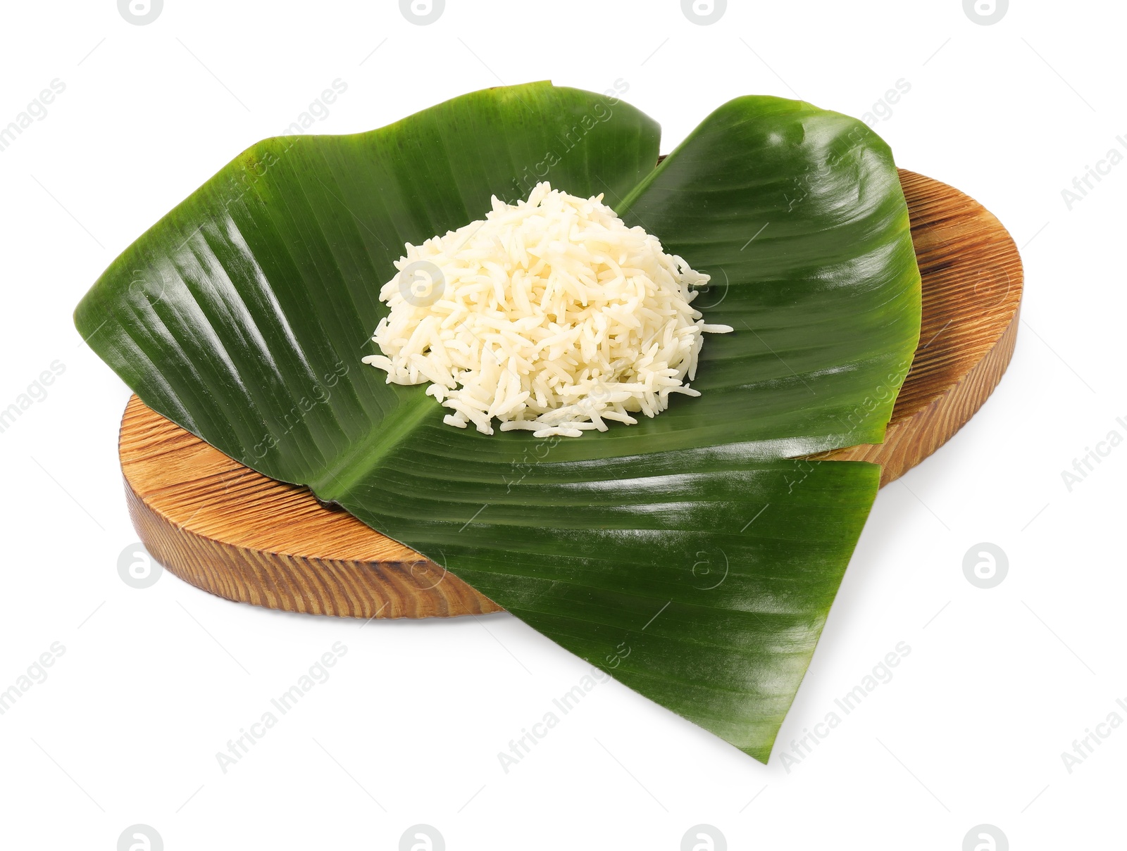 Photo of Cut banana leaf with pile of rice isolated on white. Healthy eco serving