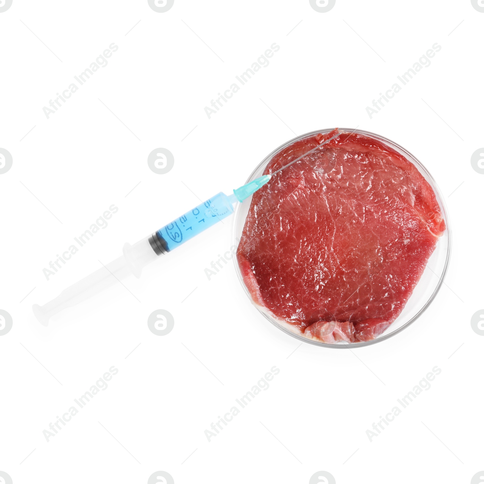 Photo of GMO concept. Piece of meat and syringe isolated on white, top view