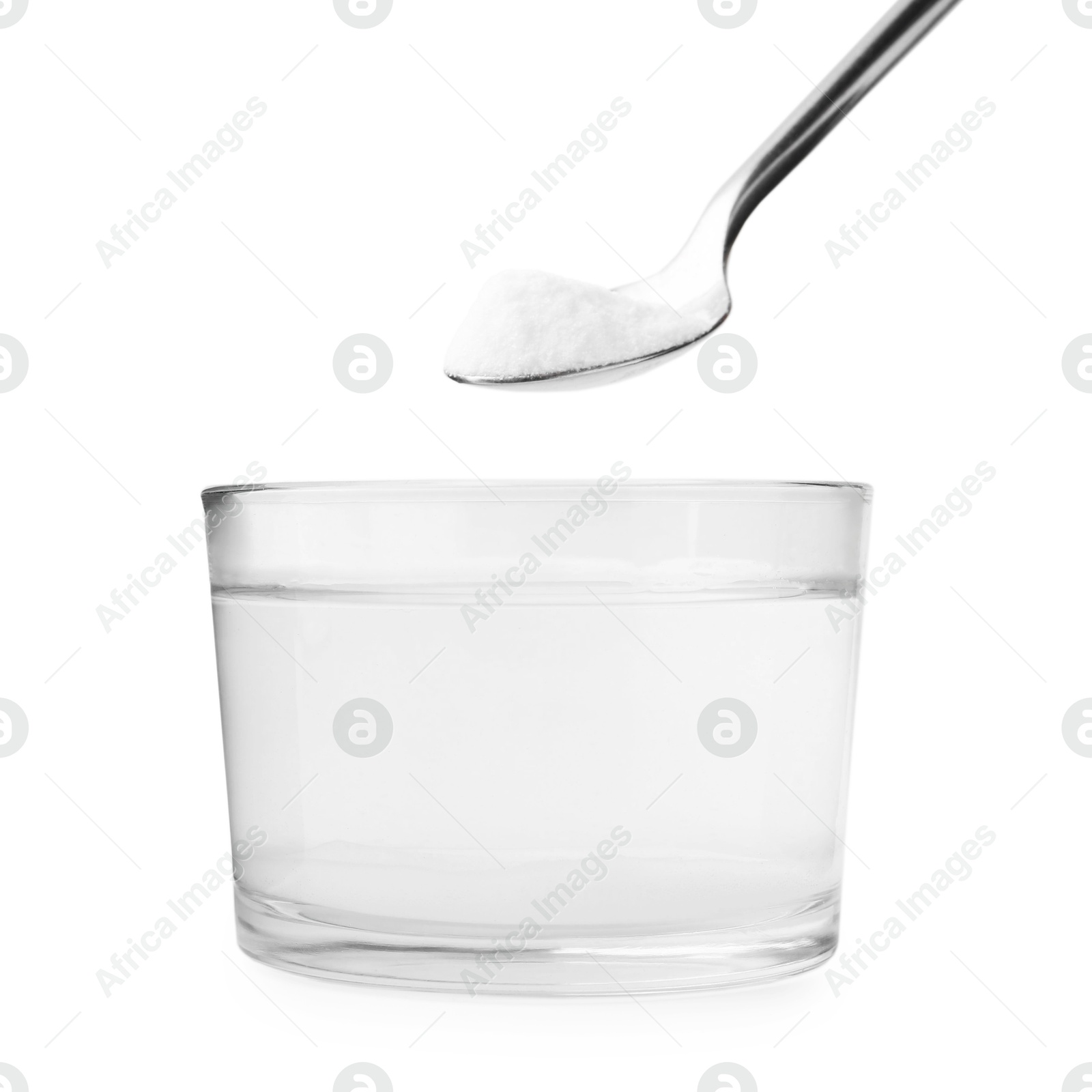 Photo of Adding baking soda to glass of water isolated on white, closeup