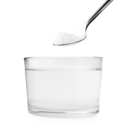 Photo of Adding baking soda to glass of water isolated on white, closeup