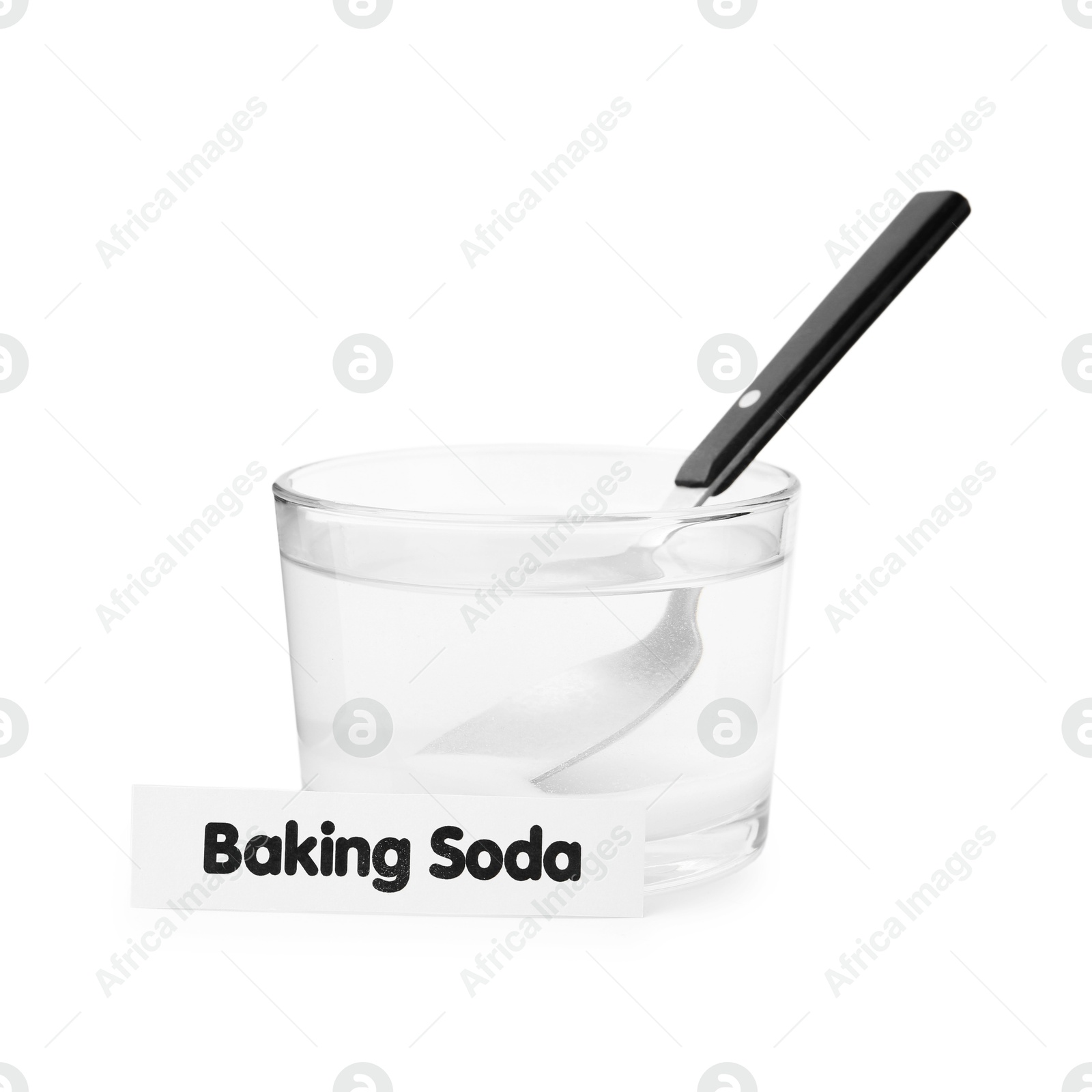 Photo of Glass of water with baking soda and spoon isolated on white