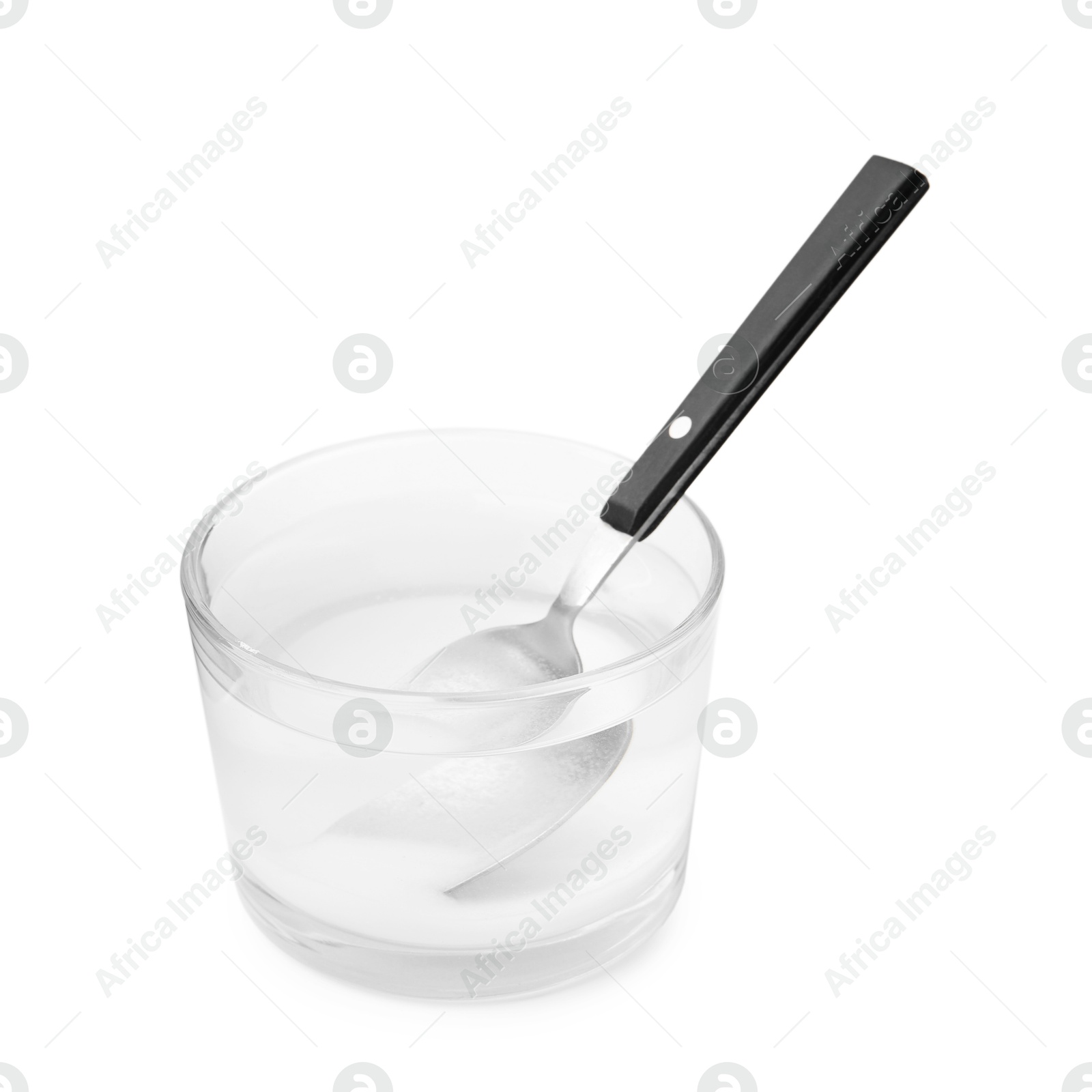 Photo of Glass of water with baking soda and spoon isolated on white