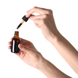 Woman with bottle of topical iodine on white background, closeup