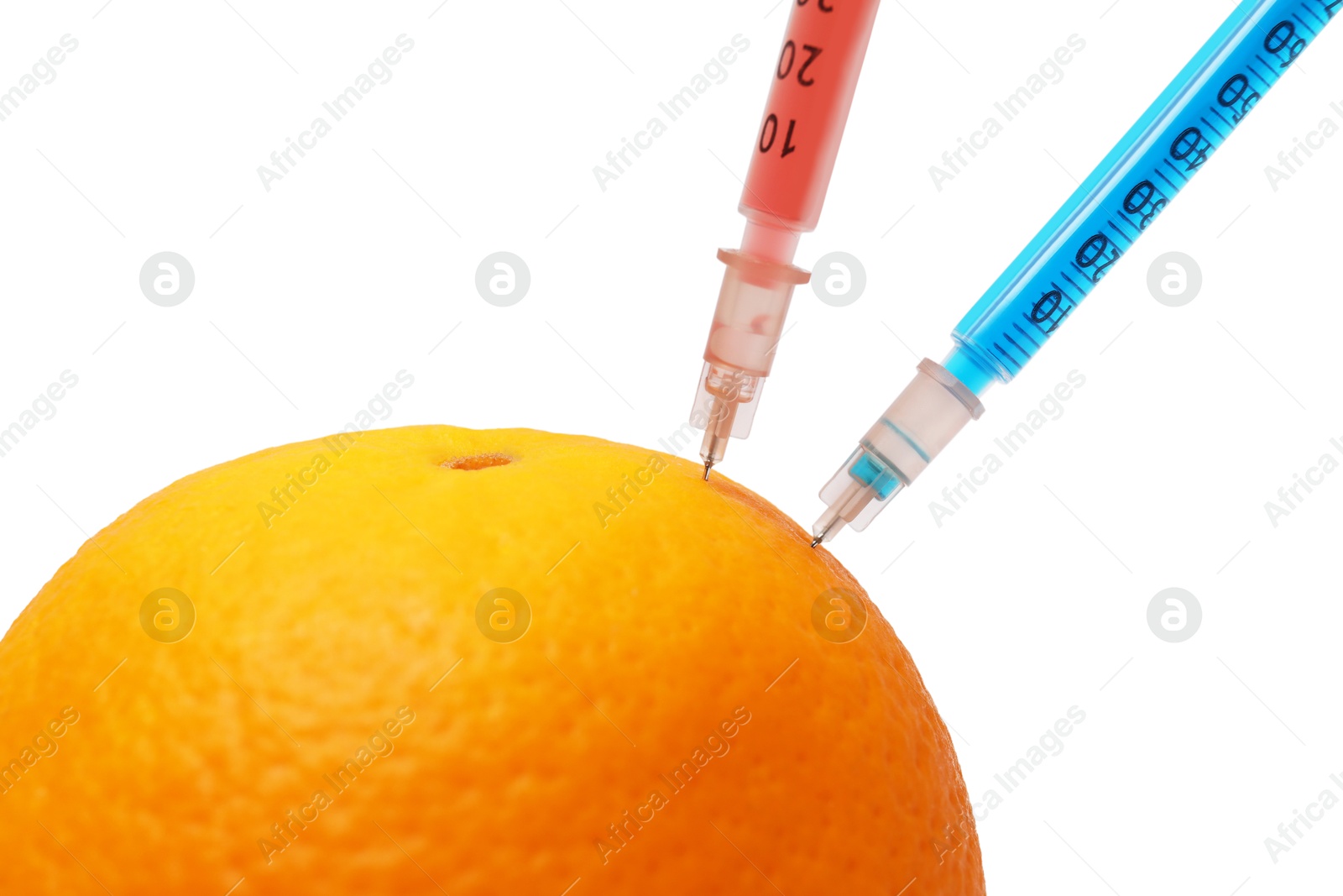 Photo of GMO concept. Fresh orange and syringes isolated on white