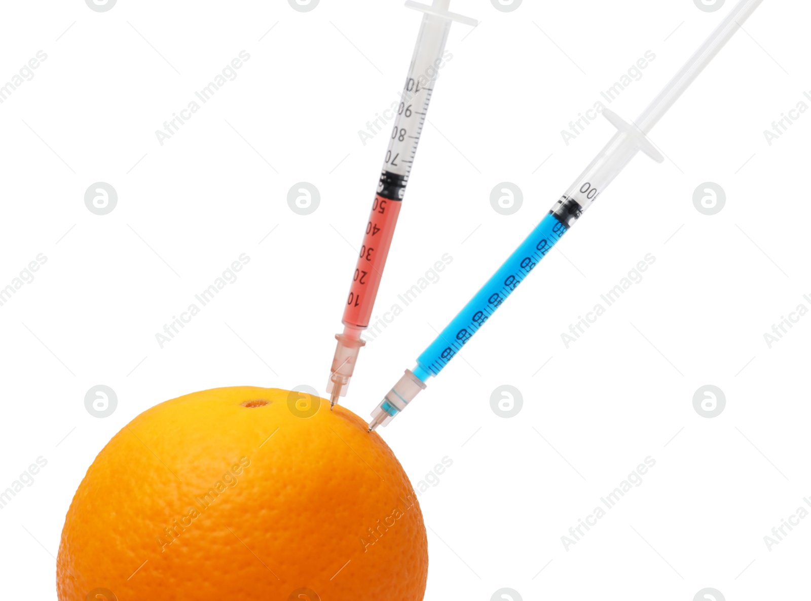 Photo of GMO concept. Fresh orange and syringes isolated on white