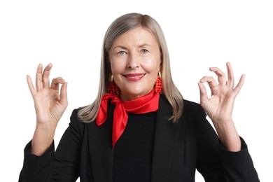 Photo of Senior woman showing okay gesture on white background