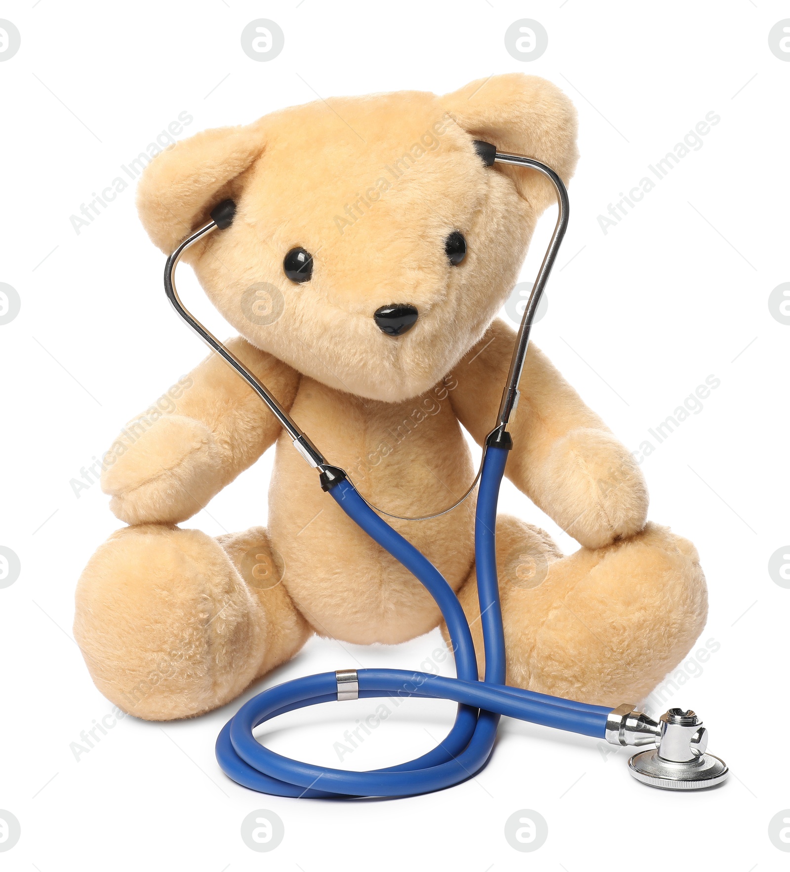 Photo of Pediatrics concept. Teddy bear and stethoscope isolated on white