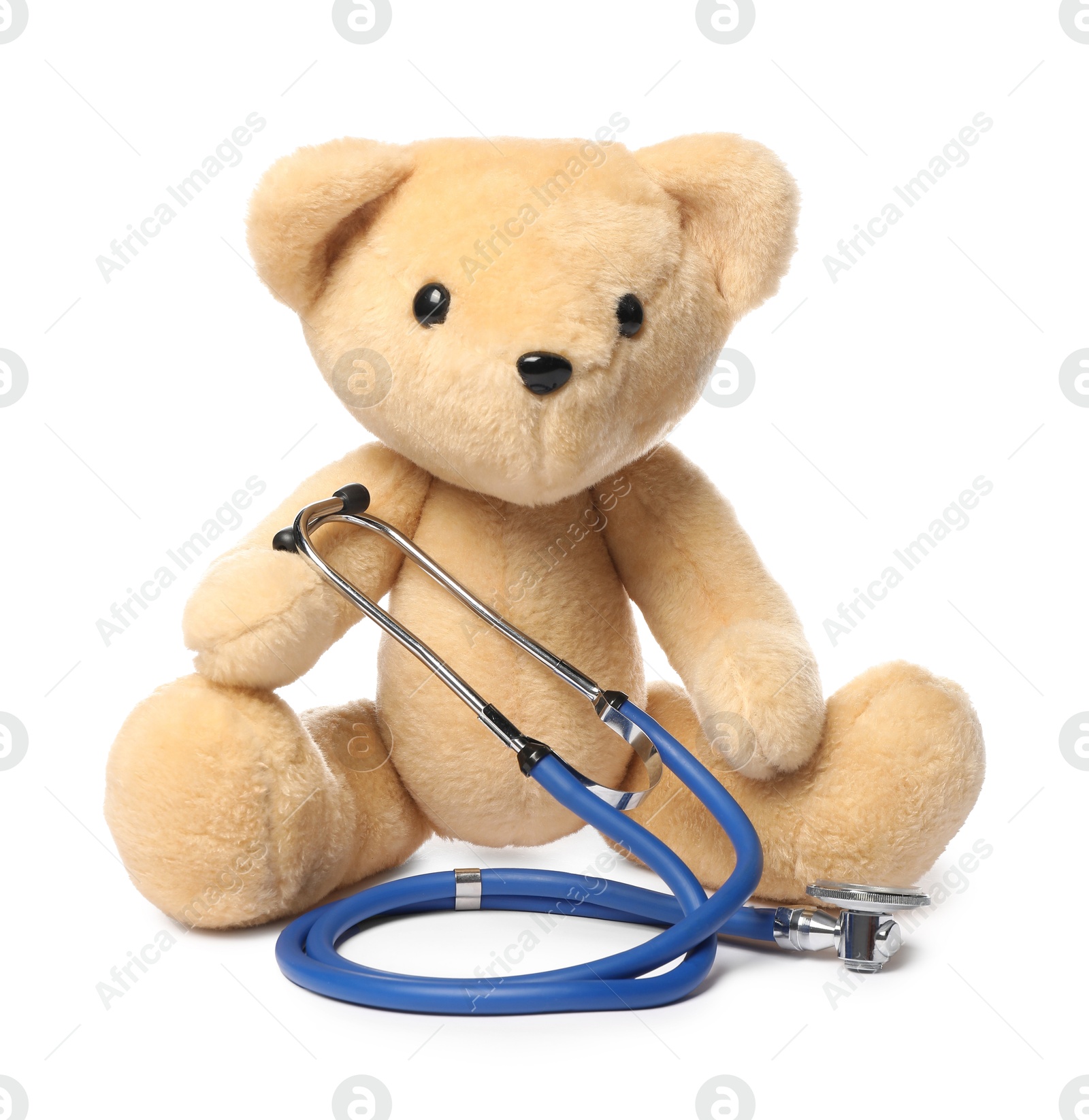 Photo of Pediatrics concept. Teddy bear and stethoscope isolated on white