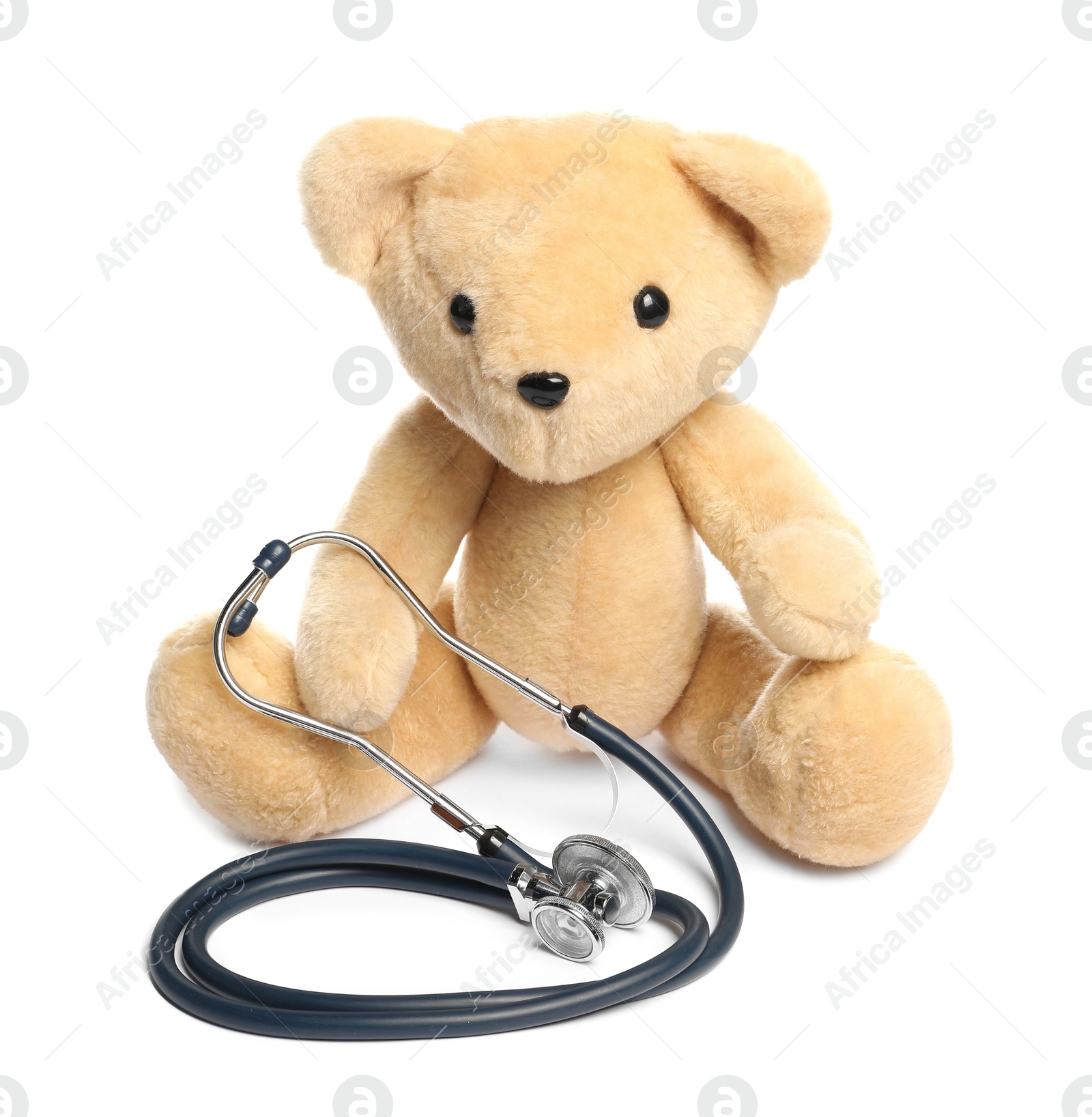 Photo of Pediatrics concept. Teddy bear and stethoscope isolated on white