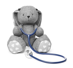 Photo of Pediatrics concept. Toy bunny with stethoscope isolated on white