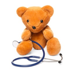 Photo of Pediatrics concept. Teddy bear with stethoscope isolated on white