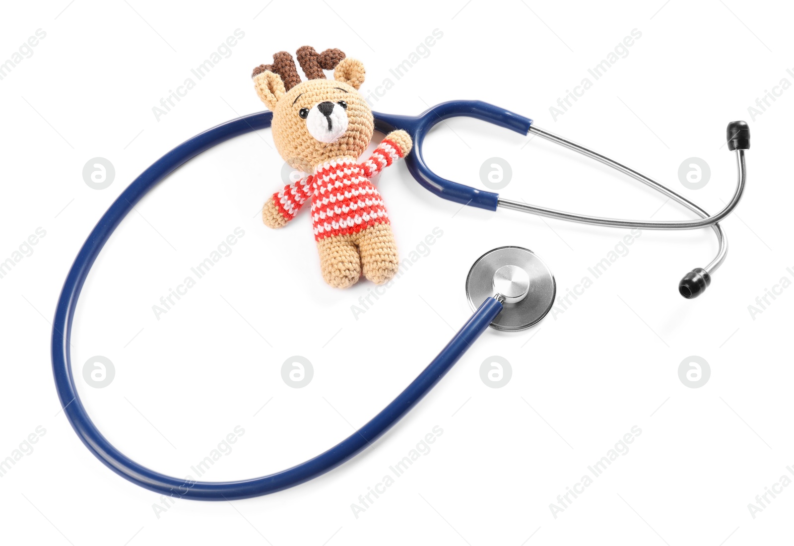 Photo of Pediatrics concept. Toy deer with stethoscope isolated on white, top view