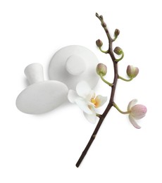 Spa stones and orchid branch isolated on white, top view