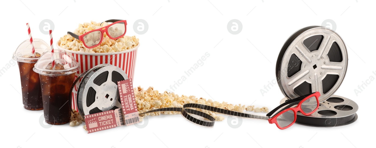 Photo of Tasty popcorn, film reels, soda drinks, glasses and movie tickets isolated on white