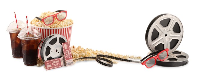 Photo of Tasty popcorn, film reels, soda drinks, glasses and movie tickets isolated on white