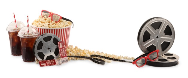 Photo of Tasty popcorn, film reels, soda drinks, glasses and movie tickets isolated on white