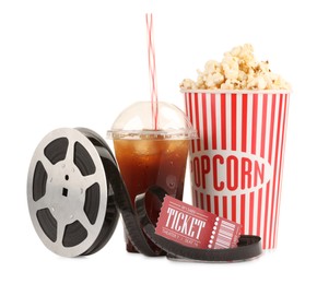 Photo of Tasty popcorn, film reel, soda drink and movie ticket isolated on white