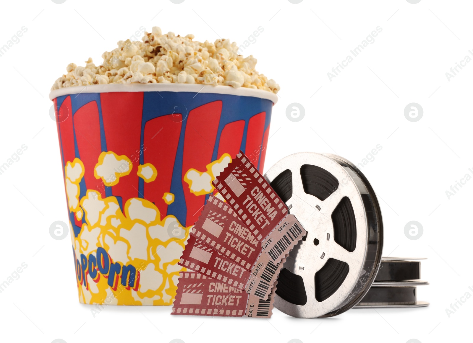 Photo of Tasty popcorn, film reels and movie tickets isolated on white