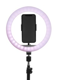 Photo of Tripod with ring light and smartphone isolated on white