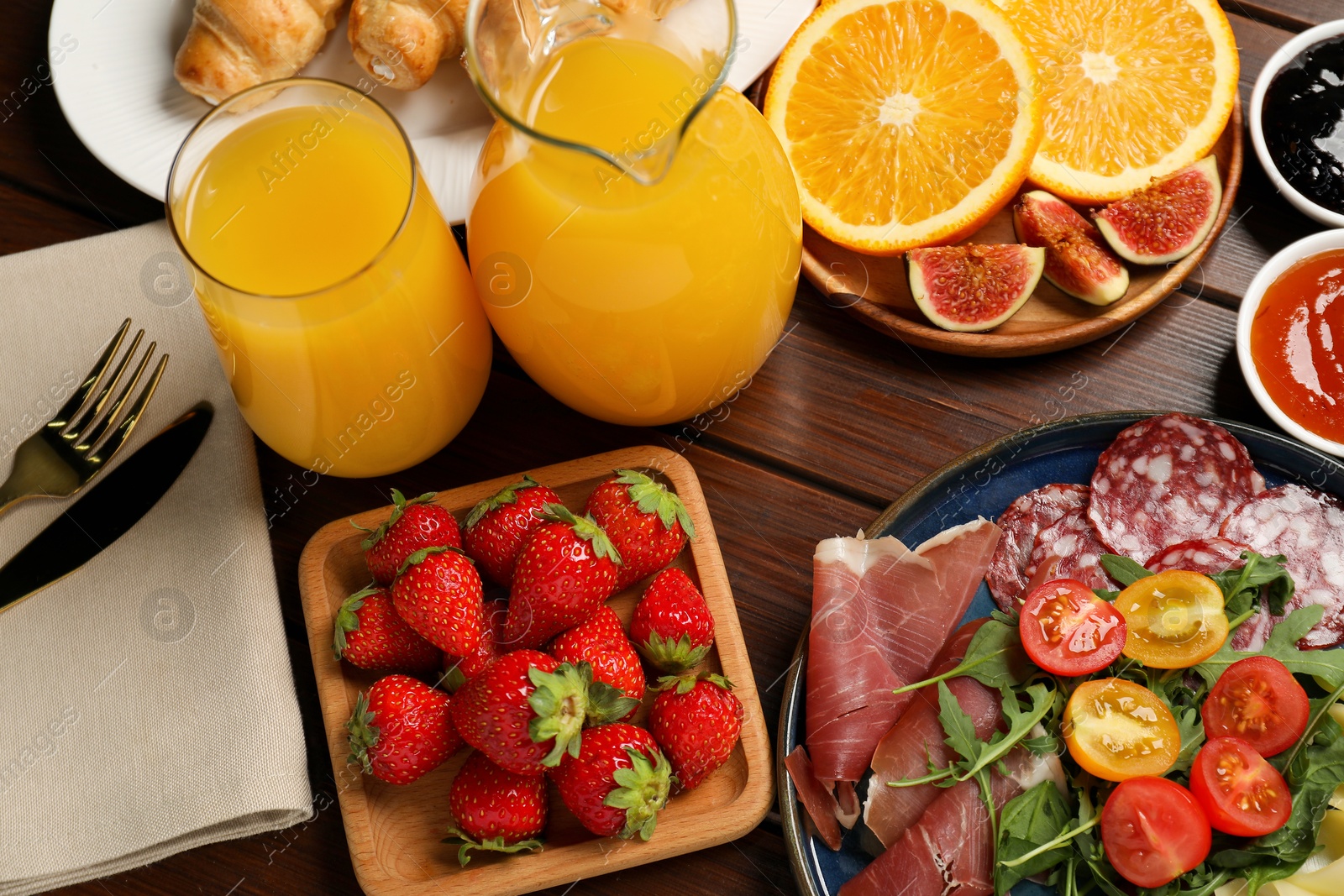 Photo of Different tasty food served for brunch on wooden table, flat lay