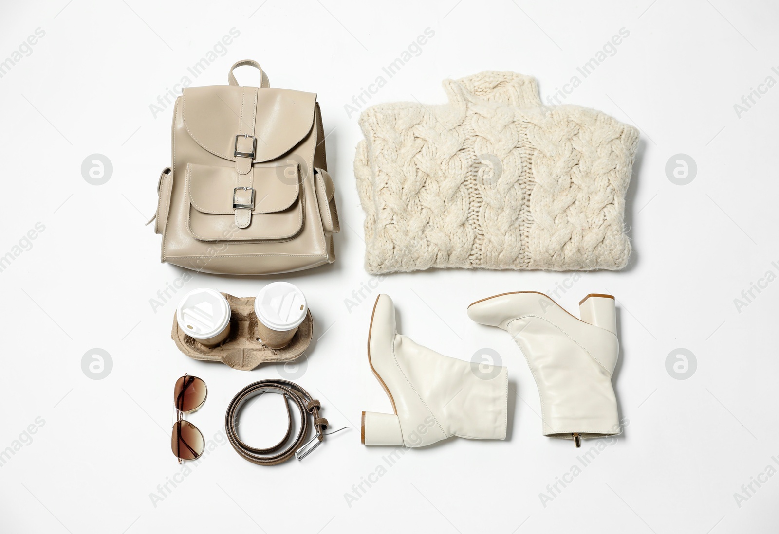 Photo of Stylish outfit with backpack on white background, flat lay