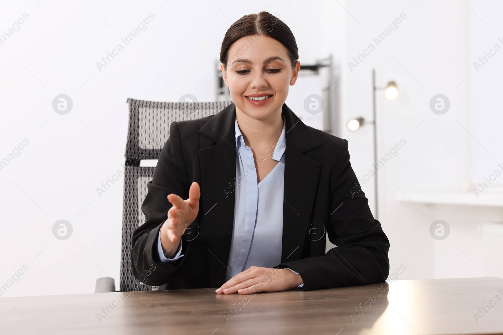 Photo of Beautiful woman looking at something in office