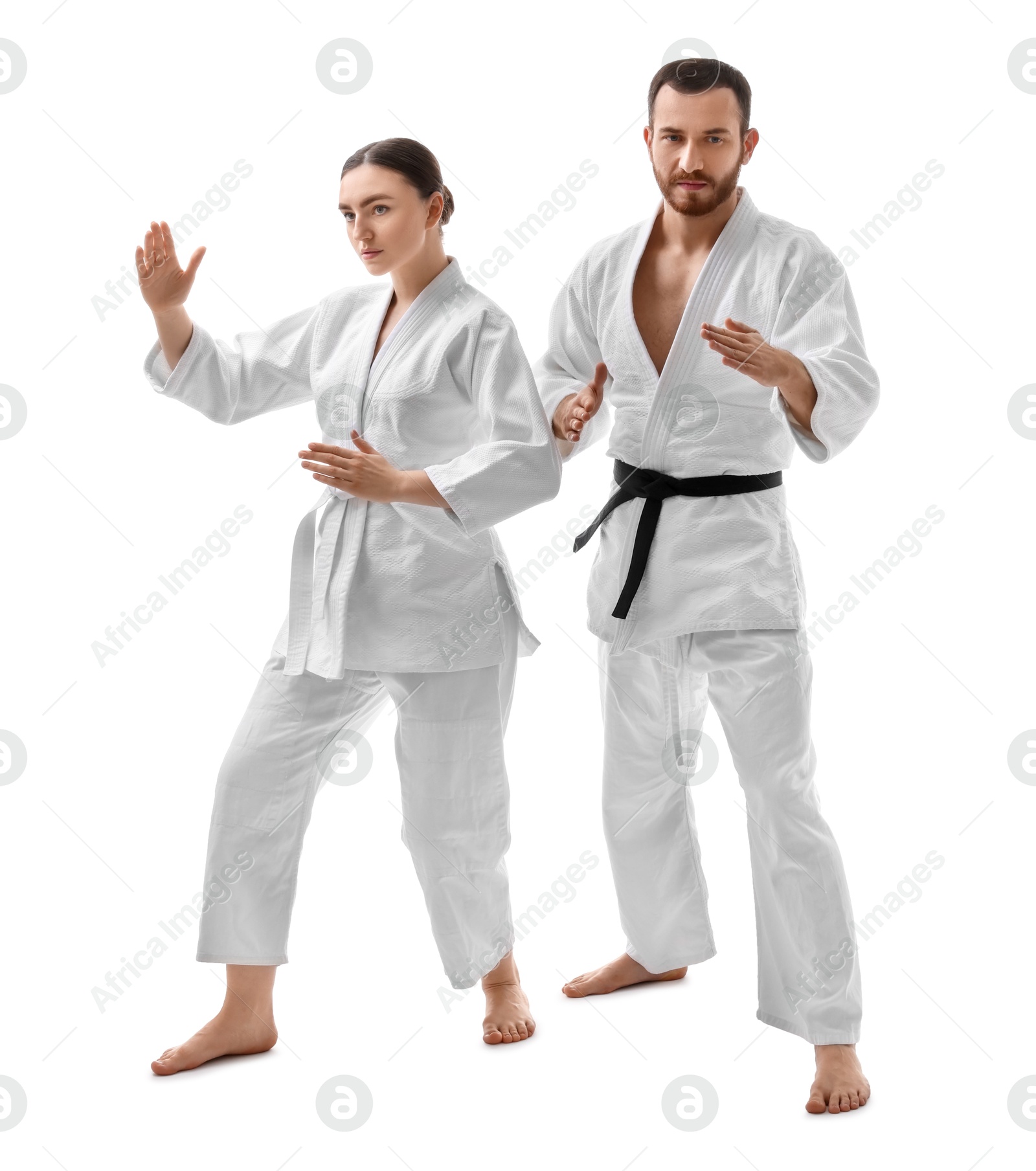 Photo of Karate fighters in uniform on white background