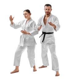 Photo of Karate fighters in uniform on white background