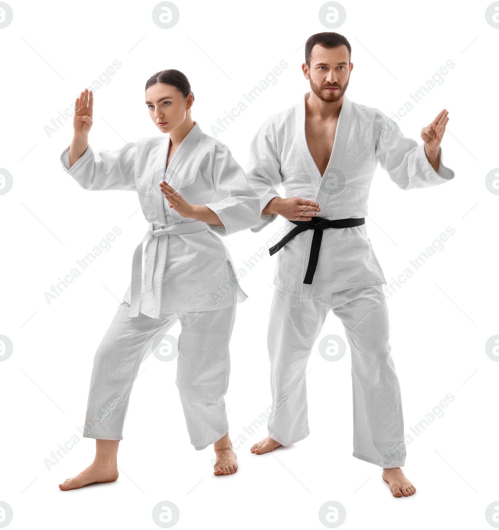 Photo of Karate fighters in uniform on white background