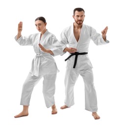 Photo of Karate fighters in uniform on white background