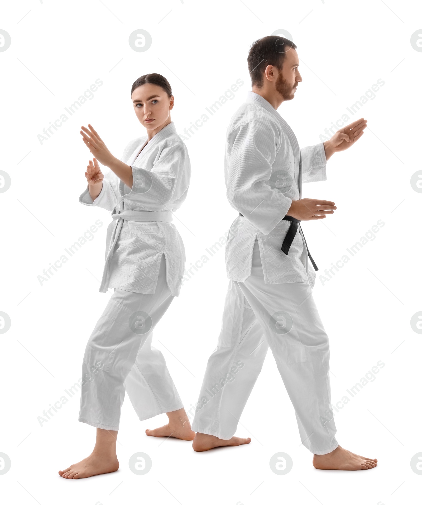 Photo of Karate fighters in uniform on white background