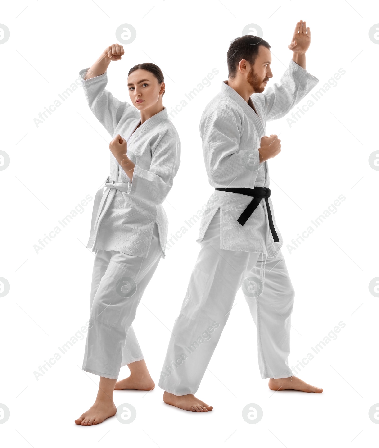 Photo of Karate fighters in uniform on white background