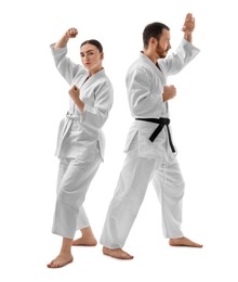 Photo of Karate fighters in uniform on white background