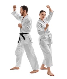 Photo of Karate fighters in uniform on white background