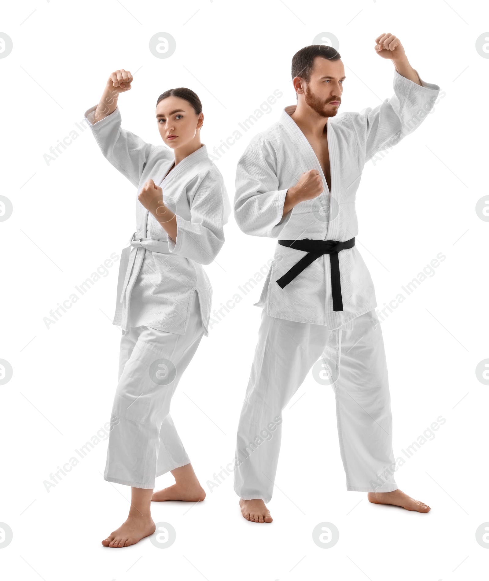 Photo of Karate fighters in uniform on white background