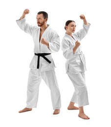 Photo of Karate fighters in uniform on white background